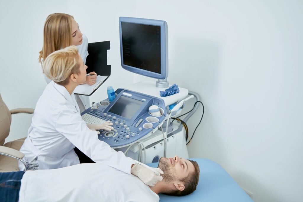 A premium high-definition Doppler ultrasound machine screen displaying a clear carotid artery blood flow scan next to a professional specialist in a luxury private clinic setting at Beverly Hills Ultrasound Center.