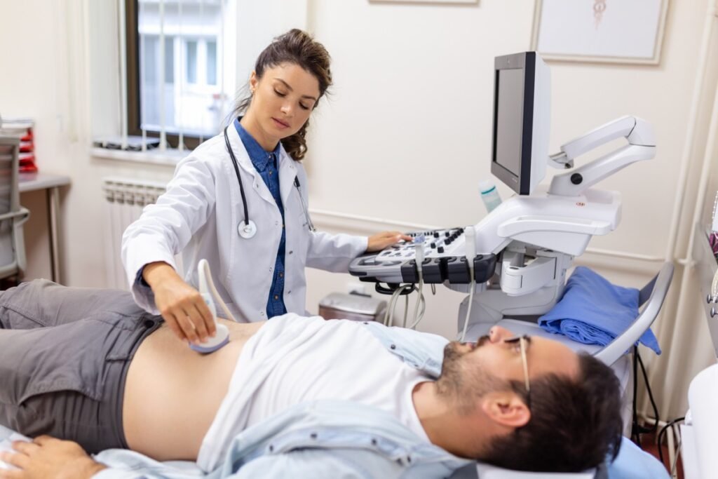 Medical professional conducting a non-invasive kidney and bladder ultrasound scan on a patient to evaluate the urinary tract system at Beverly Hills Ultrasound Center.